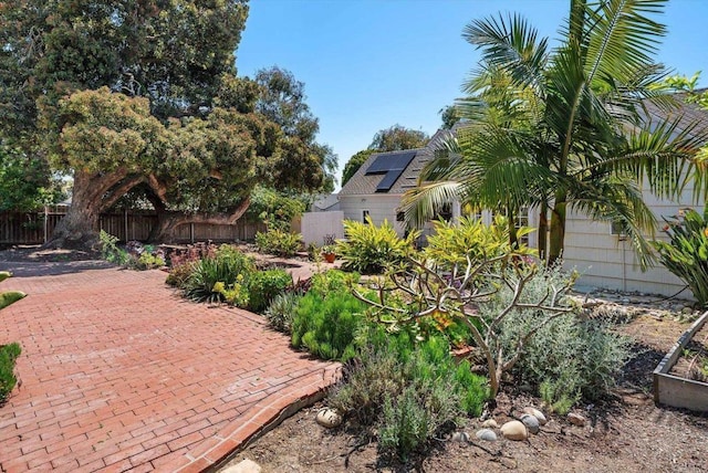 view of yard with fence and a patio