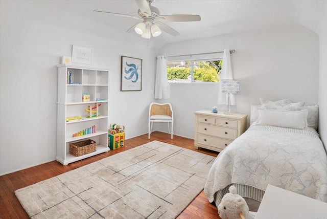 bedroom featuring a ceiling fan and wood finished floors