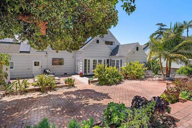 back of property with french doors and a patio