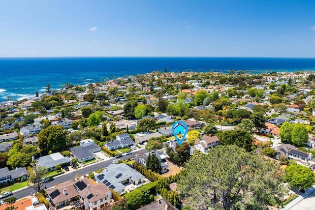 drone / aerial view featuring a residential view and a water view