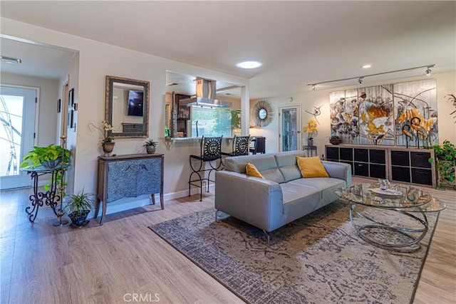 7019 Fairfield Dr, Santa Rosa, CA 95409 - living area with wood finished floors, plenty of natural light, track lighting, and recessed lighting