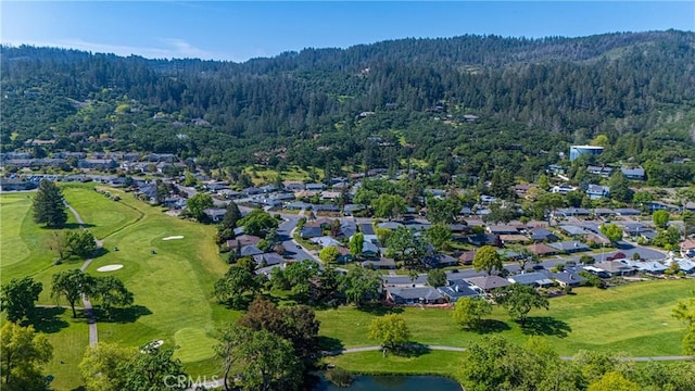 birds eye view of property featuring a residential view, a wooded view, and golf course view