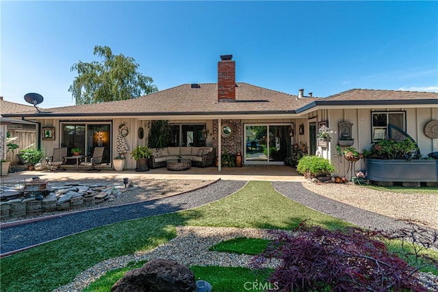 7019 Fairfield Dr, Santa Rosa, CA 95409 - rear view of house with a chimney, a patio, a shingled roof, and board and batten siding