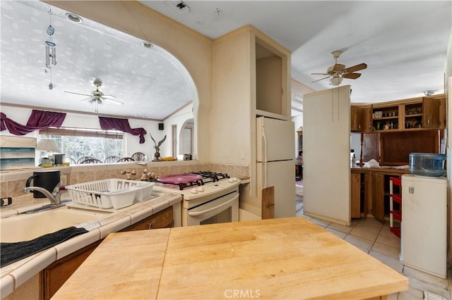 20780 Calle Rocio, Temecula, CA 92590 - kitchen featuring white appliances, ceiling fan, a sink, and tile countertops