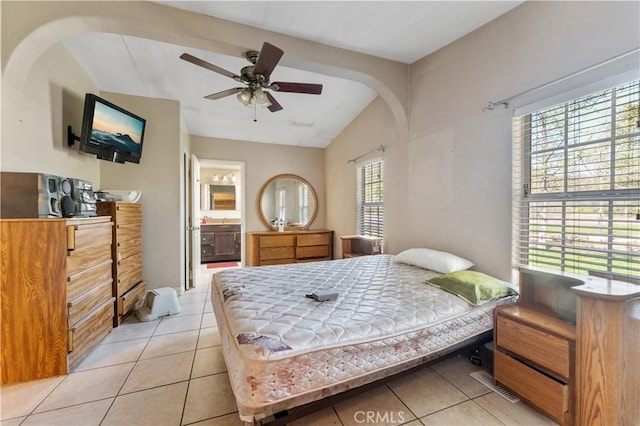 20780 Calle Rocio, Temecula, CA 92590 - bedroom featuring vaulted ceiling, light tile patterned floors, arched walkways, ensuite bathroom, and ceiling fan