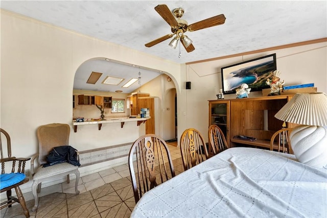 20780 Calle Rocio, Temecula, CA 92590 - bedroom with arched walkways, light tile patterned floors, crown molding, ceiling fan, and lofted ceiling