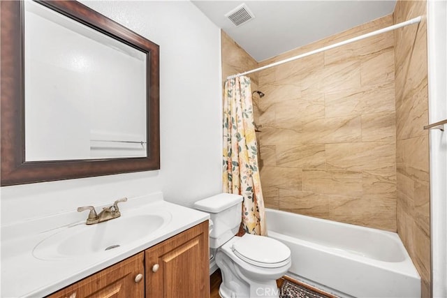 full bath with visible vents, shower / bath combo, toilet, and vanity