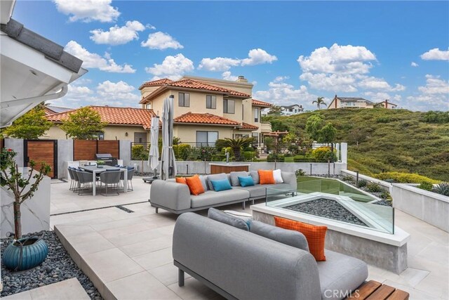 303 Calle Paisano, San Clemente, CA 92673 - view of patio with outdoor dining space, fence, and an outdoor living space