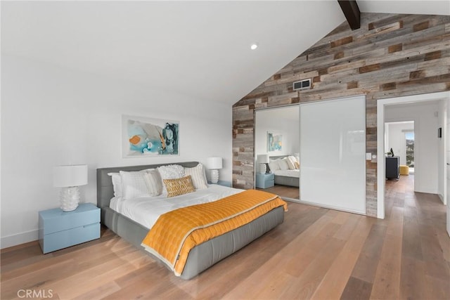 303 Calle Paisano, San Clemente, CA 92673 - bedroom featuring wood finished floors, high vaulted ceiling, visible vents, beamed ceiling, and wooden walls