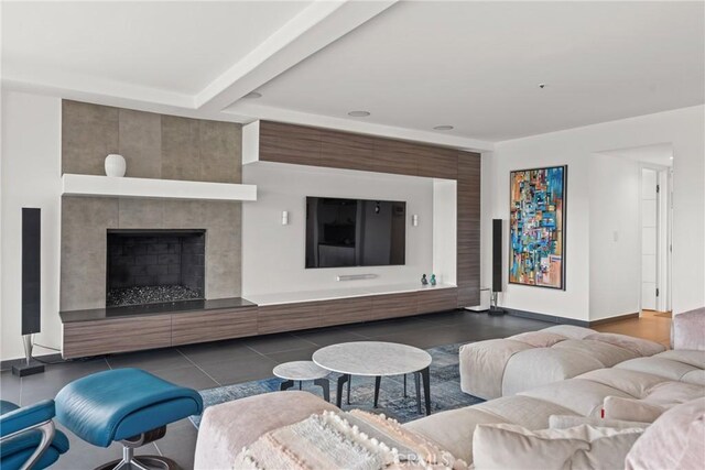 303 Calle Paisano, San Clemente, CA 92673 - tiled living room with beamed ceiling, baseboards, and a tiled fireplace