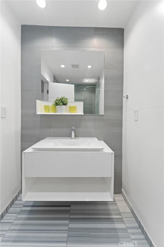 303 Calle Paisano, San Clemente, CA 92673 - full bath with tile walls, visible vents, vanity, and a shower