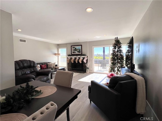 24052 Estacia Ave, Laguna Niguel, CA 92677 - living room with visible vents, recessed lighting, a stone fireplace, and light wood-type flooring