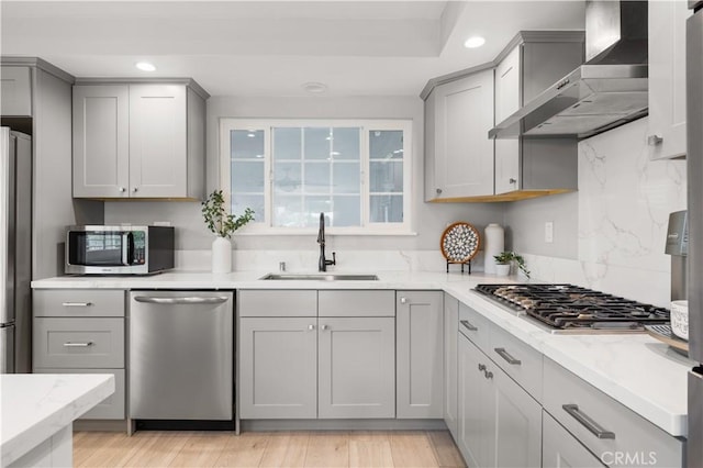 24052 Estacia Ave, Laguna Niguel, CA 92677 - kitchen with wall chimney range hood, recessed lighting, gray cabinets, a sink, and appliances with stainless steel finishes