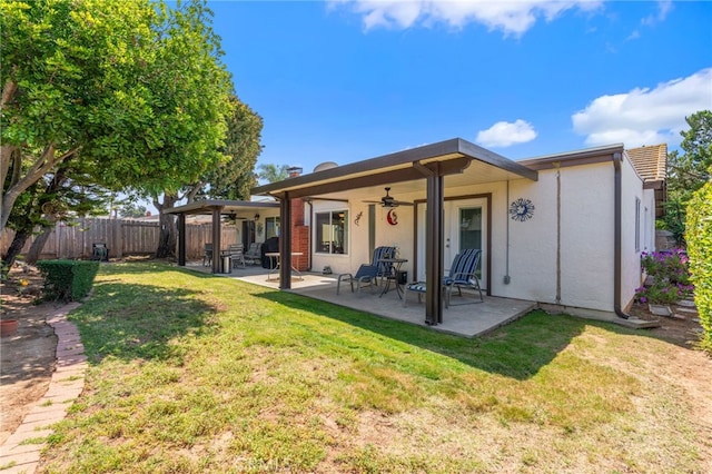 1316 Via Ln, Ranchita, San Marcos, CA 92069 - rear view of property featuring stucco siding, a fenced backyard, a ceiling fan, a patio, and a yard
