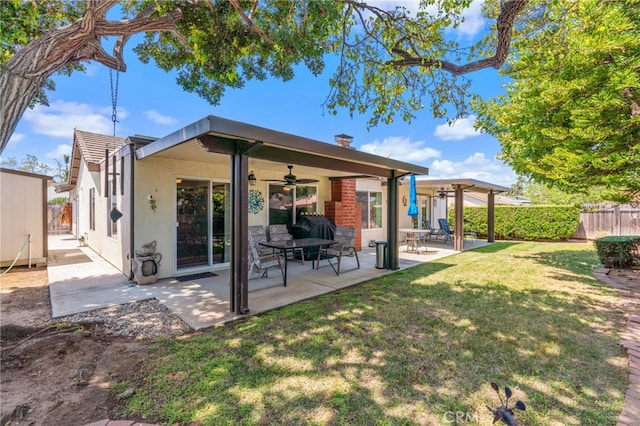 1316 Via Ln, Ranchita, San Marcos, CA 92069 - rear view of house featuring a ceiling fan, a fenced backyard, a yard, a patio, and stucco siding