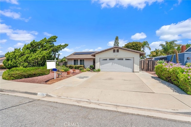 1316 Via Ln, Ranchita, San Marcos, CA 92069 - ranch-style home with driveway, solar panels, fence, an attached garage, and stucco siding