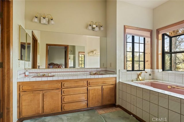 32424 Snowshoe Ln, Running Springs, CA 92382 - full bath featuring vanity, backsplash, a garden tub, and tile patterned floors