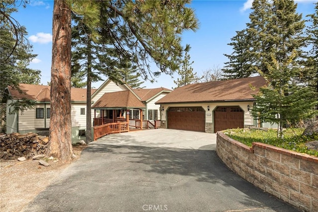 32424 Snowshoe Ln, Running Springs, CA 92382 - single story home with a garage, covered porch, and driveway