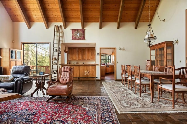 32424 Snowshoe Ln, Running Springs, CA 92382 - living area with high vaulted ceiling, a healthy amount of sunlight, and wooden ceiling