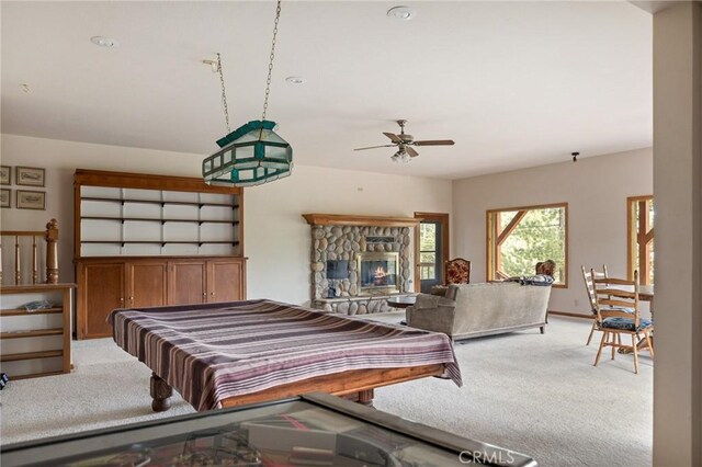 32424 Snowshoe Ln, Running Springs, CA 92382 - rec room featuring ceiling fan, light carpet, and a stone fireplace