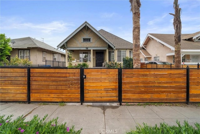 view of front of property with a fenced front yard and stucco siding