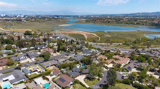 bird's eye view with a residential view and a water view