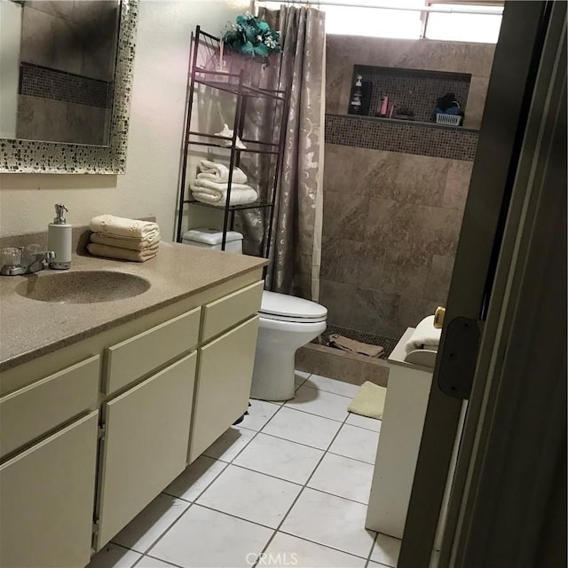 40964 156th St E, Lancaster, CA 93535 - bathroom featuring vanity, toilet, tile patterned floors, and a stall shower