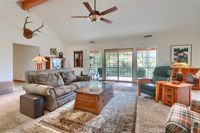 tiled living area featuring ceiling fan, visible vents, beam ceiling, and high vaulted ceiling