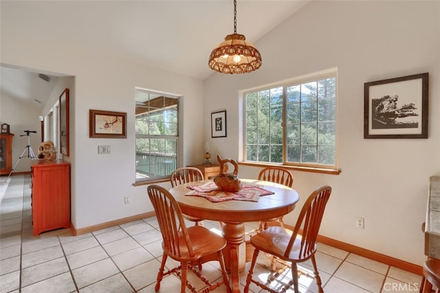 dining area featuring light tile patterned floors, baseboards, and a wealth of natural light