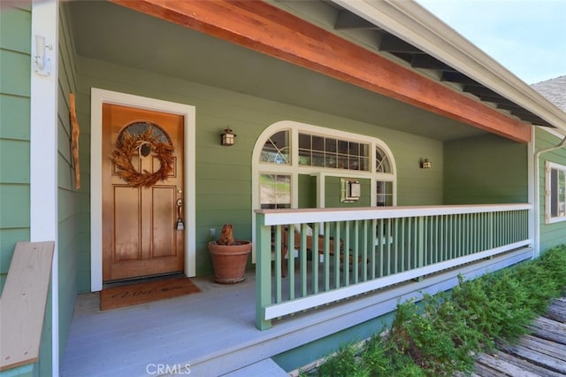 doorway to property featuring a porch