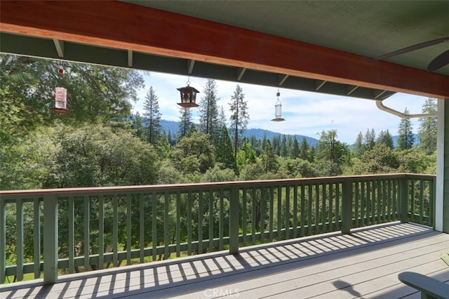wooden deck featuring a wooded view