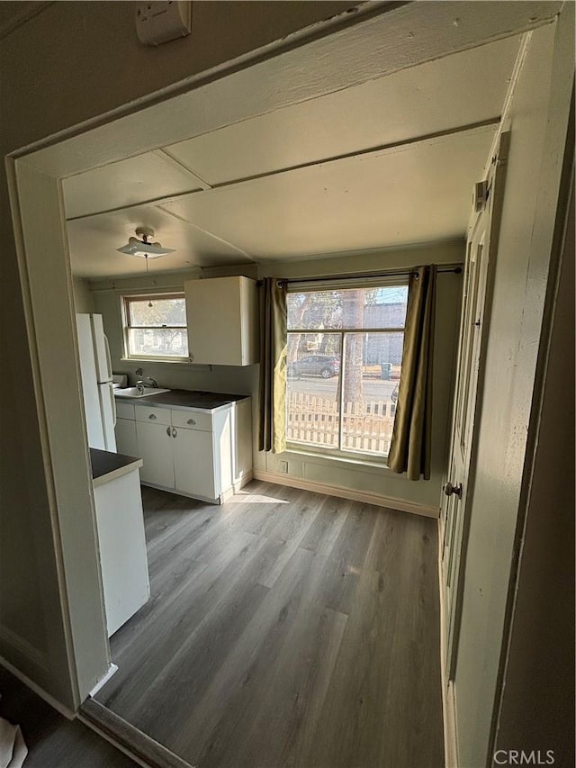 3499 Lemon St, Riverside, CA 92501 - unfurnished dining area with baseboards, wood finished floors, and a wealth of natural light