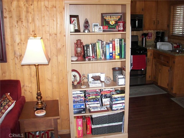 interior details with wood walls and gas range