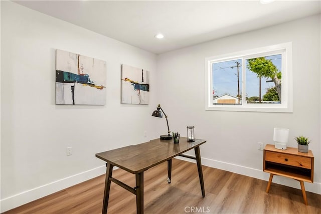 office with recessed lighting, baseboards, and light wood finished floors