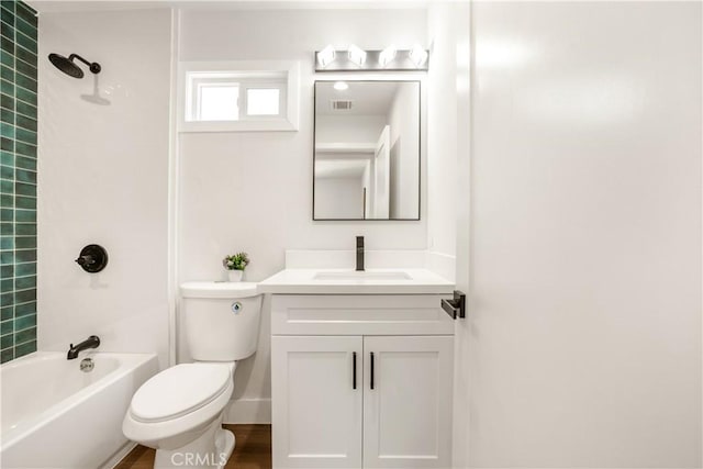 bathroom featuring toilet, visible vents, tub / shower combination, and vanity