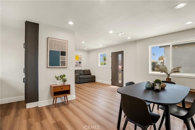 dining area featuring baseboards, recessed lighting, light wood-style flooring, and visible vents
