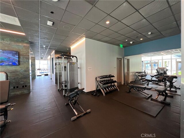 workout area featuring a drop ceiling