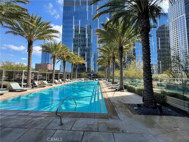 community pool featuring a patio area