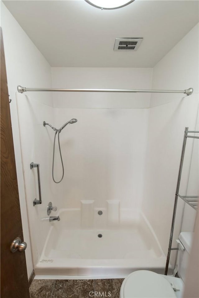 full bathroom featuring tile patterned floors, walk in shower, toilet, and visible vents