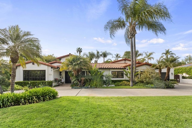 17182 Camino Acampo, Rancho Santa Fe, CA 92067 - mediterranean / spanish-style home featuring stucco siding, a tile roof, and a front yard