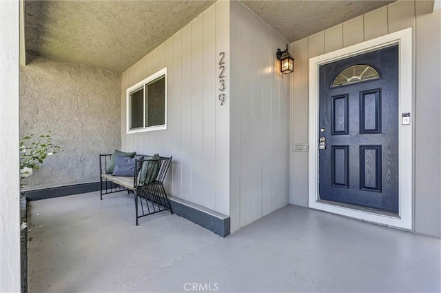 entrance to property featuring a porch