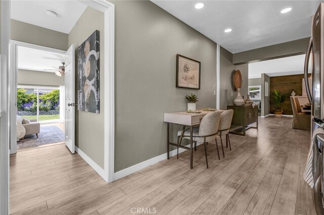 hall with recessed lighting, baseboards, and light wood-style floors