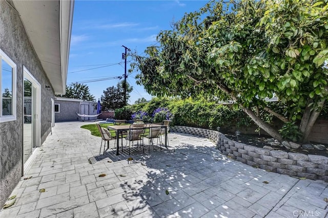 view of patio featuring outdoor dining space