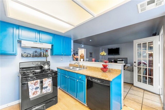 kitchen featuring blue cabinets, visible vents, a sink, black appliances, and under cabinet range hood