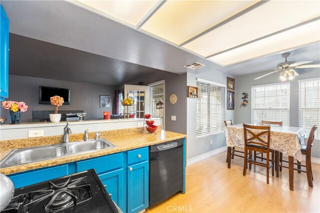 kitchen featuring a sink, light wood-style flooring, black dishwasher, baseboards, and blue cabinets