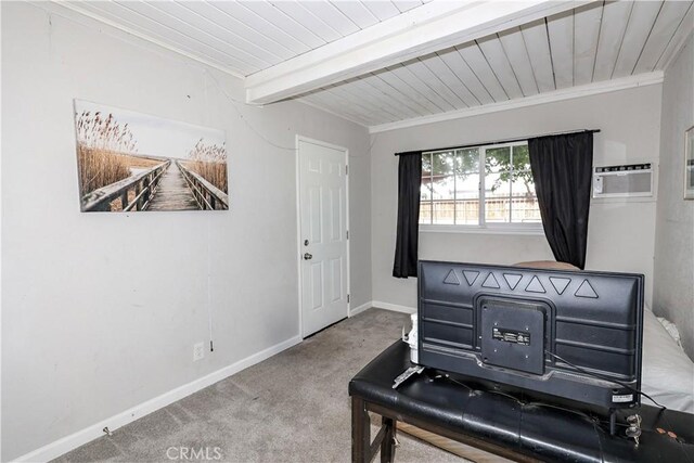 interior space featuring carpet floors, baseboards, wooden ceiling, a wall unit AC, and beamed ceiling