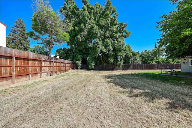 view of yard with a fenced backyard