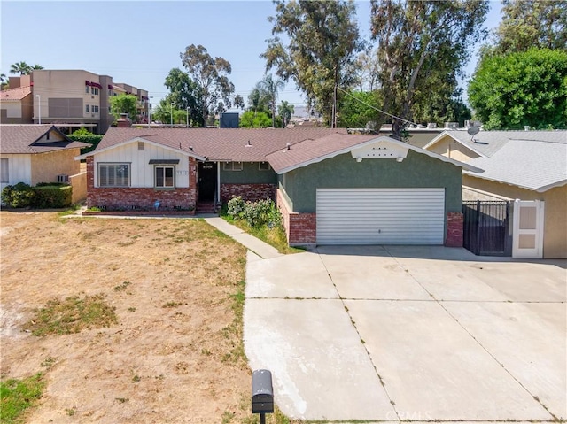 9810 Sharon Ave, Riverside, CA 92503 - ranch-style home featuring brick siding, a garage, driveway, and board and batten siding