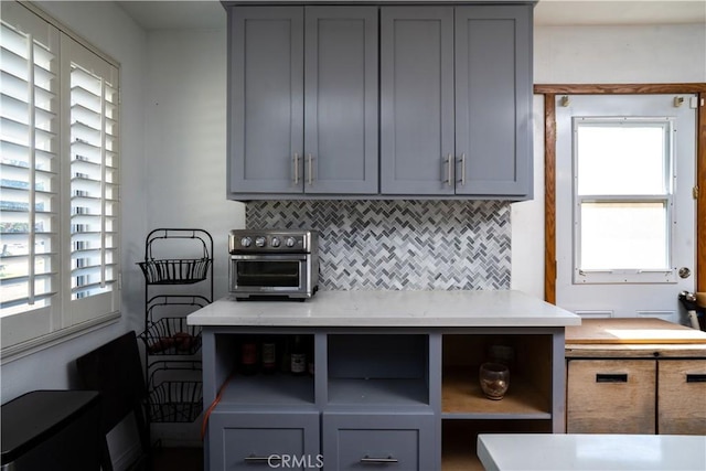 9810 Sharon Ave, Riverside, CA 92503 - kitchen with gray cabinets and plenty of natural light