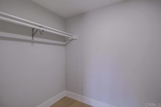 walk in closet featuring light wood-type flooring